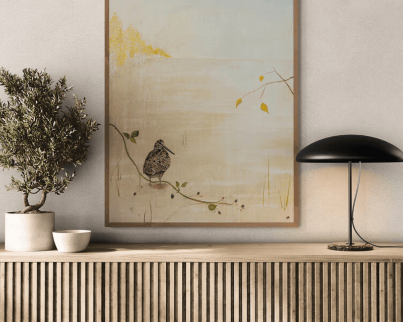 kunsttryk af sneppe i ramme på stuevæg