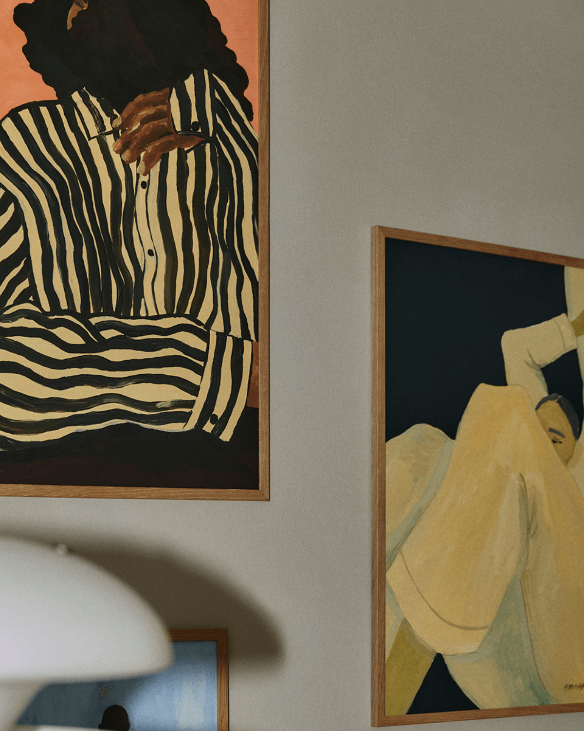 udsnit af væg med kunsttryk fra the poster club